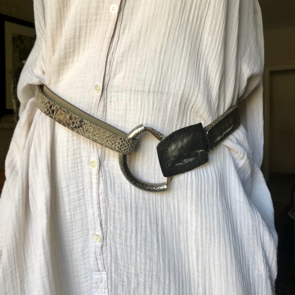 Snakeskin “like” leather belt w/ silver metal “buckle”. Art piece
